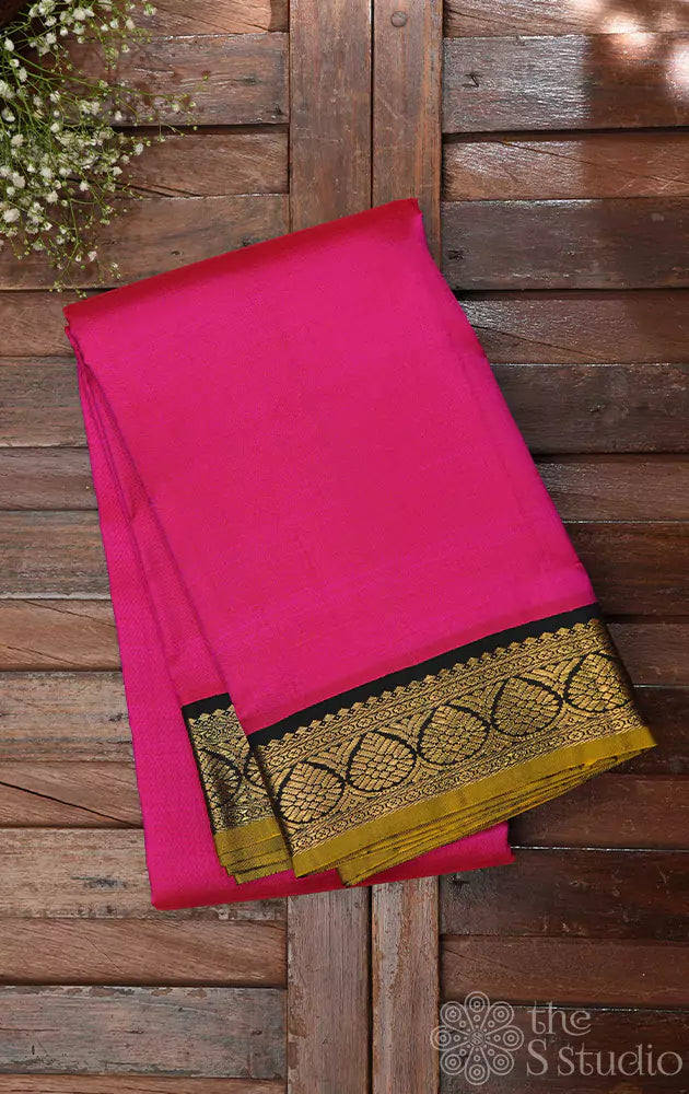 Bright rani pink kanchipuram silk saree with small korvai black border