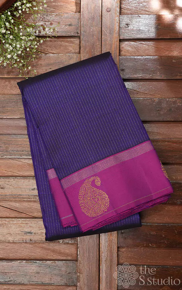 Bluish violet kanchipuram silk saree with purple border and vertical zari lines