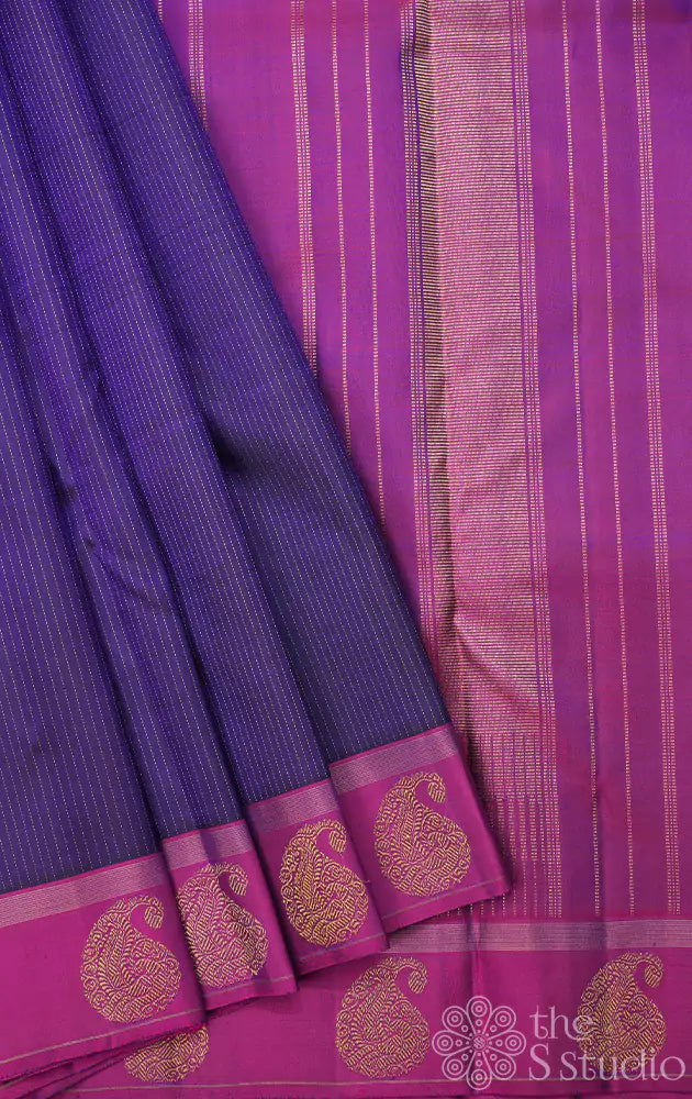 Bluish violet kanchipuram silk saree with purple border and vertical zari lines