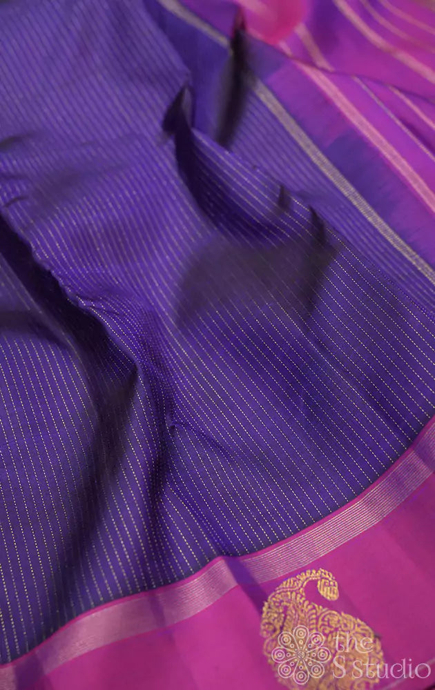 Bluish violet kanchipuram silk saree with purple border and vertical zari lines
