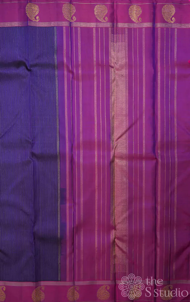 Bluish violet kanchipuram silk saree with purple border and vertical zari lines