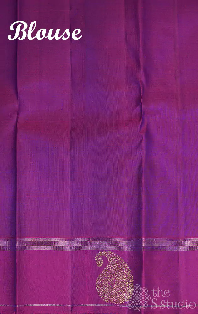 Bluish violet kanchipuram silk saree with purple border and vertical zari lines
