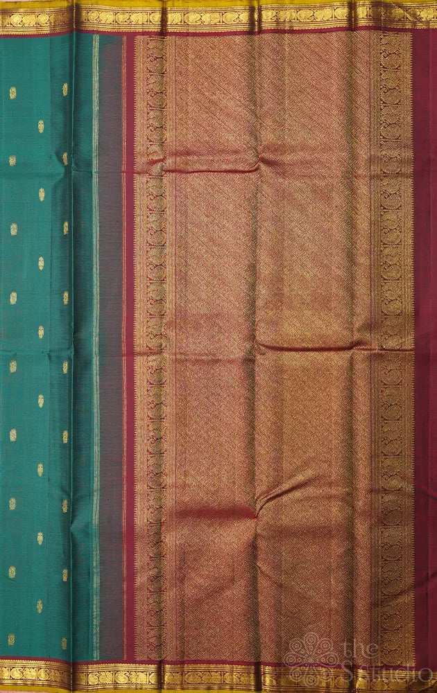 Emerald green kanchipuram silk saree with small zari border