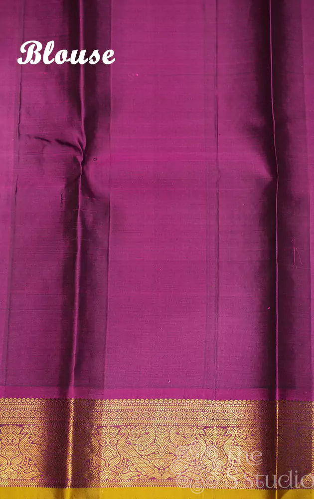 Leaf green kanchi pattu saree with magenta border
