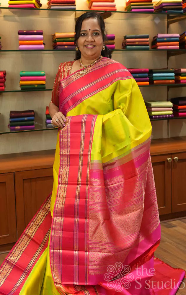 Sampanga green kanjivaram silk saree with rani pink korvai border