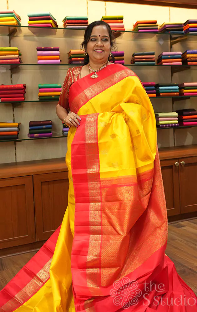 Mango yellow kanchi silk saree with bright red korvai border