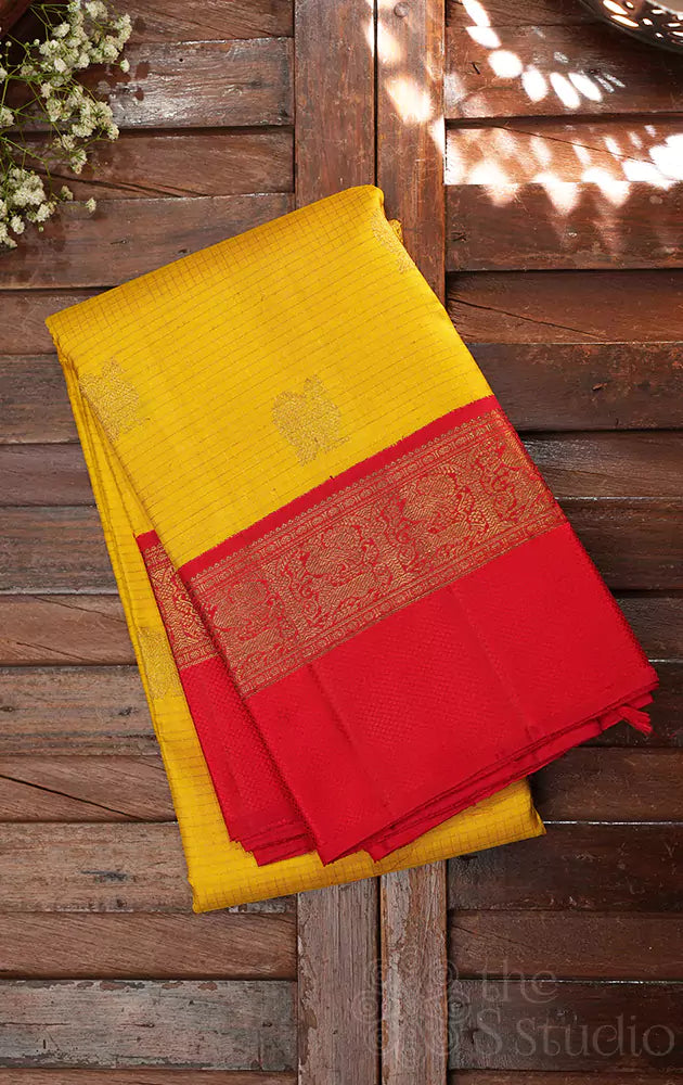 Mango yellow kanchi silk saree with bright red korvai border