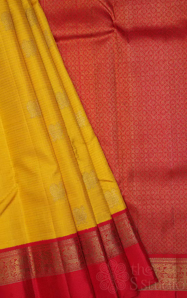 Mango yellow kanchi silk saree with bright red korvai border