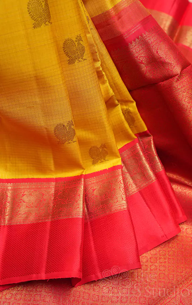 Mango yellow kanchi silk saree with bright red korvai border