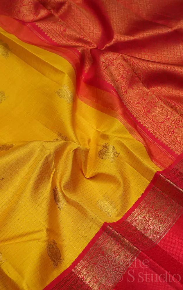 Mango yellow kanchi silk saree with bright red korvai border