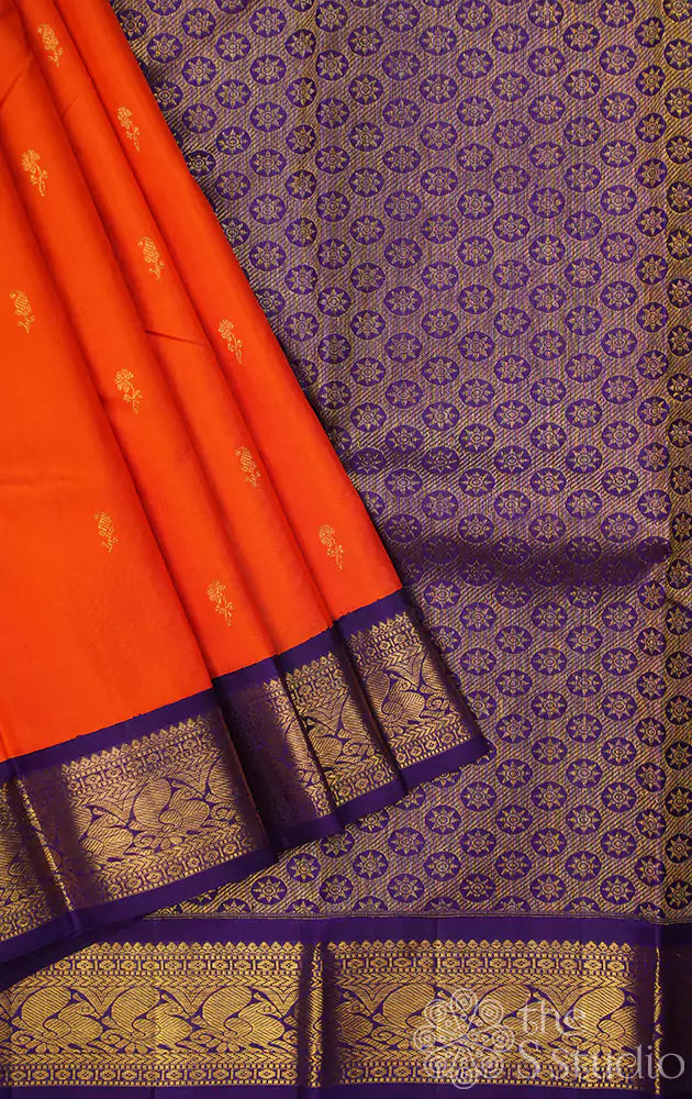 Orange kanchipuram silk saree with Navy Blue korvai border