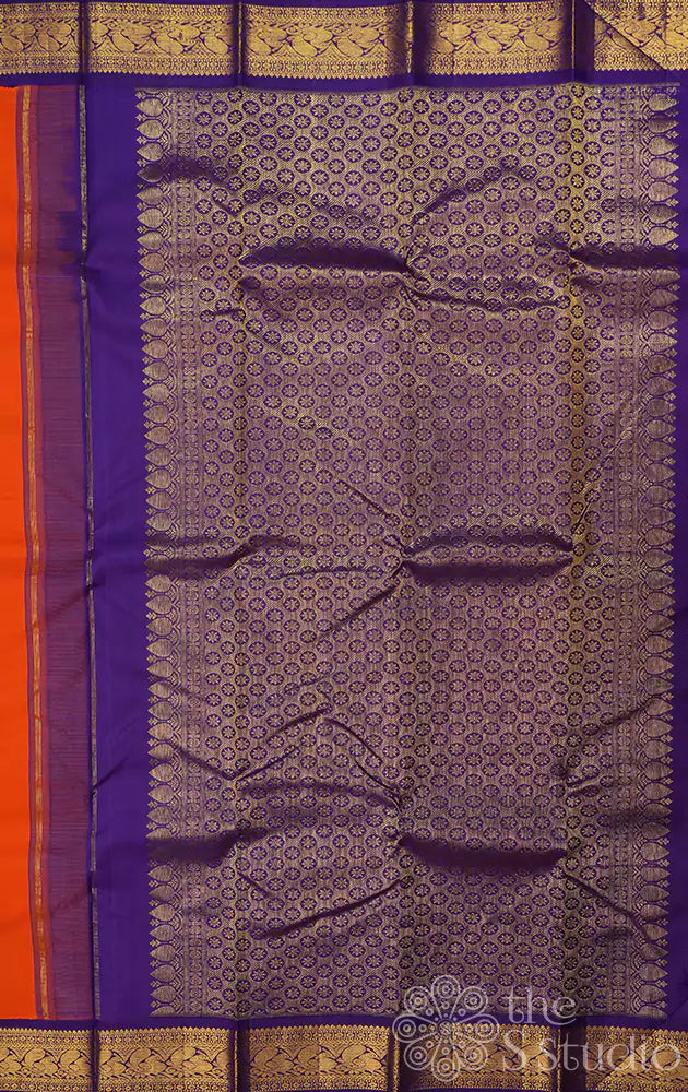 Orange kanchipuram silk saree with Navy Blue korvai border