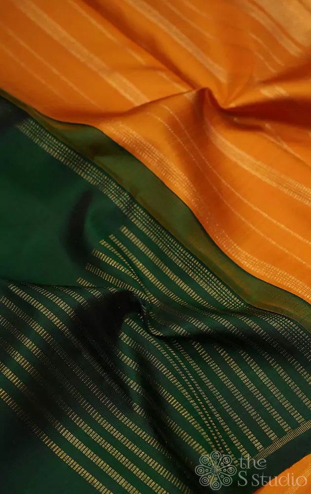 Green box pattern zari lines kanchi silk saree