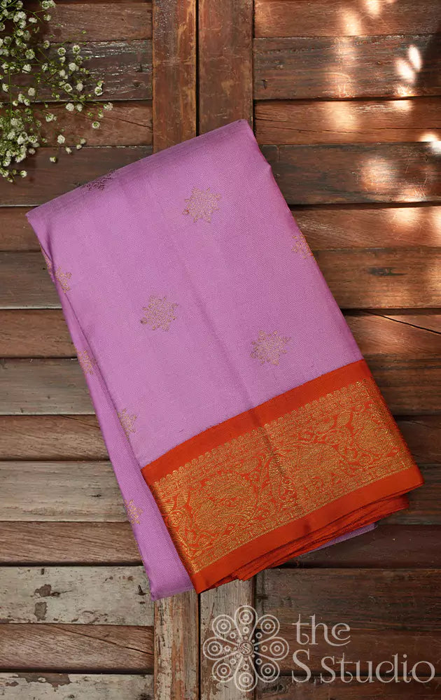Lavender colour kanjivaram silk saree with a korvai orange border