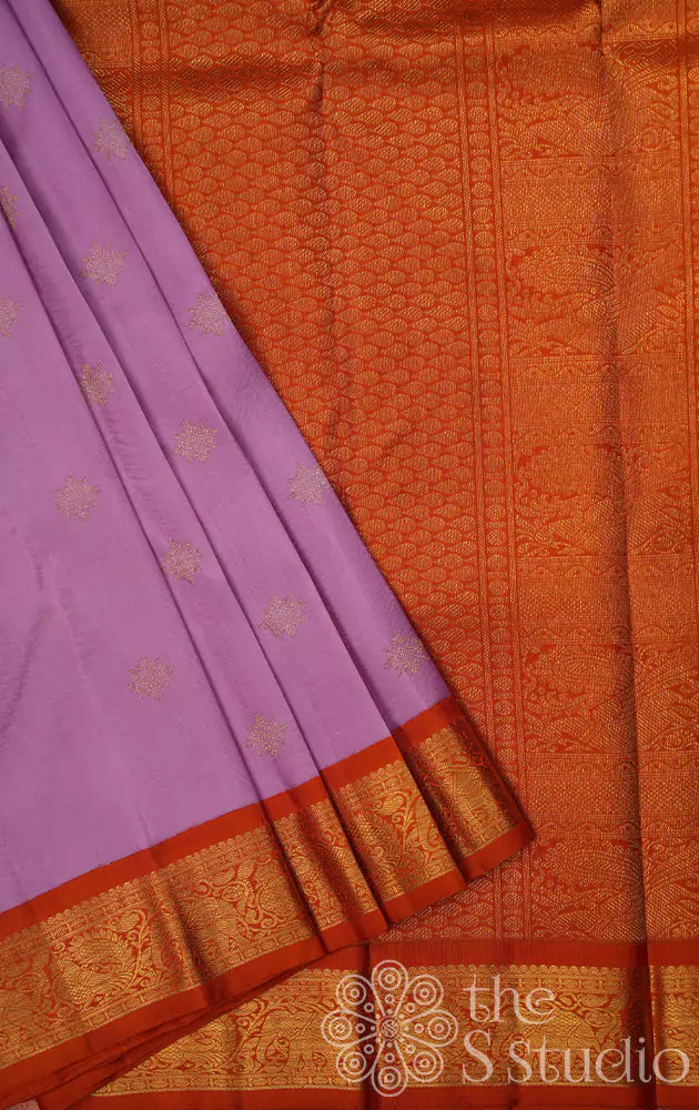 Lavender colour kanjivaram silk saree with a korvai orange border