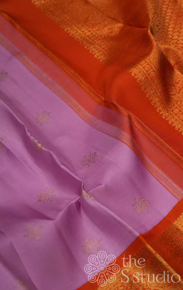 Lavender colour kanjivaram silk saree with a korvai orange border