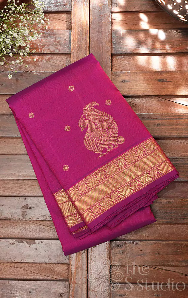 Magenta kanchi pattu saree with annam motifs along the border