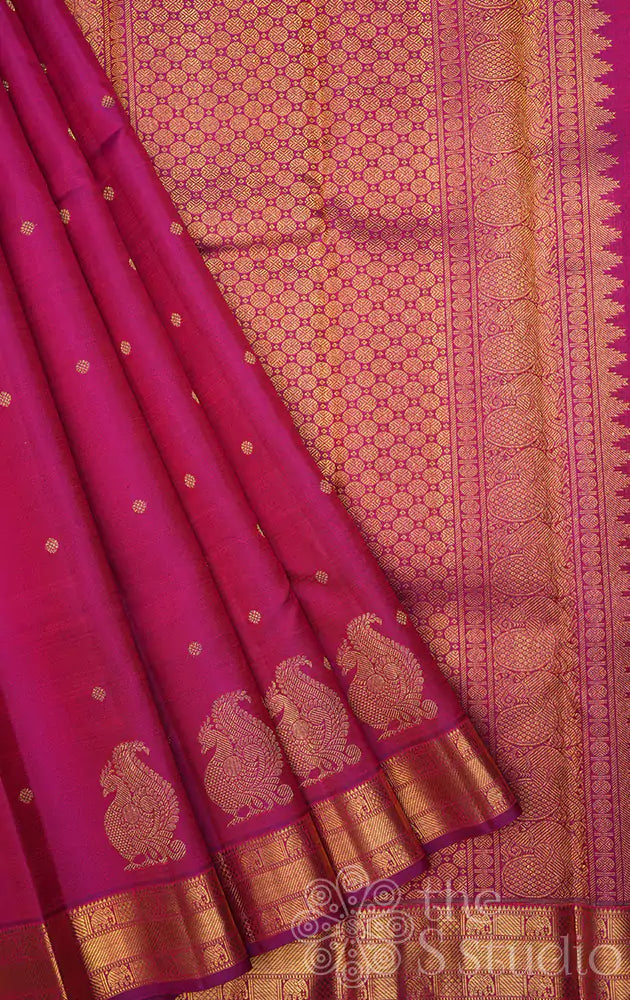 Magenta kanchi pattu saree with annam motifs along the border