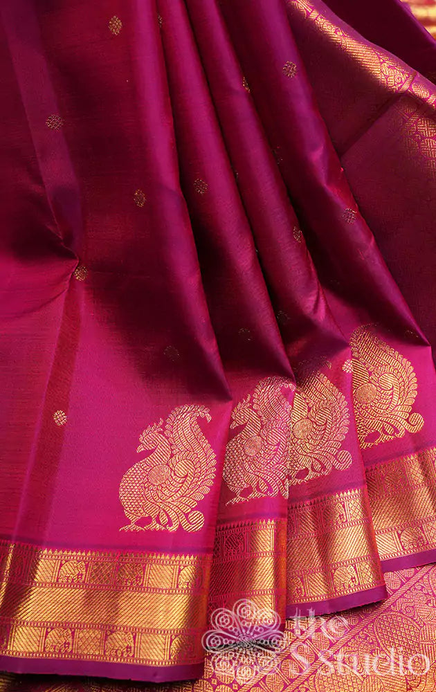 Magenta kanchi pattu saree with annam motifs along the border