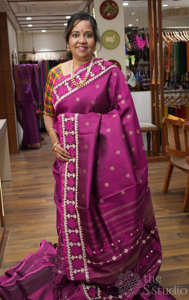 Magenta kanchipuram silk saree with hand kutch embroidered border