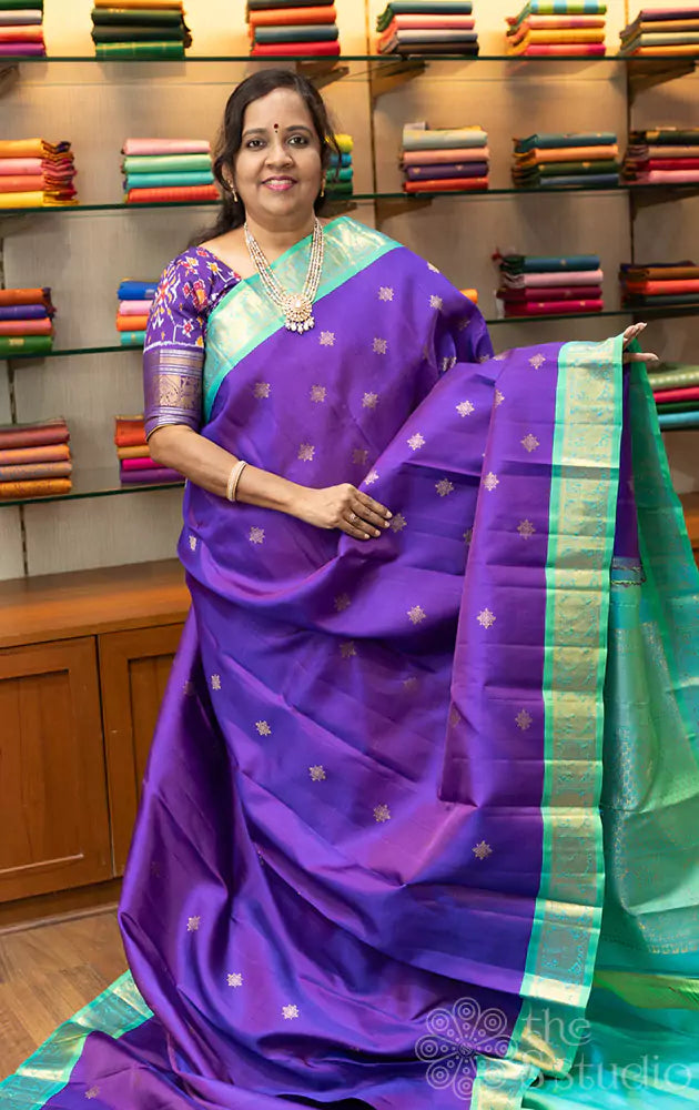 Violet Kanchipuram silk saree with sea green korvai border