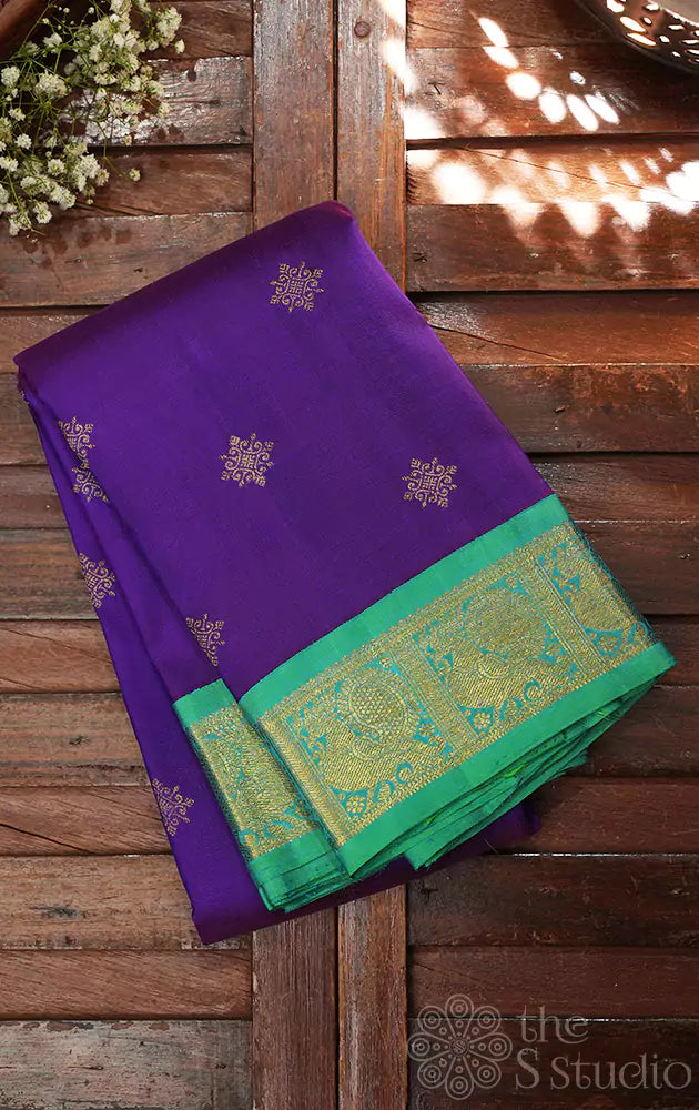 Violet Kanchipuram silk saree with sea green korvai border