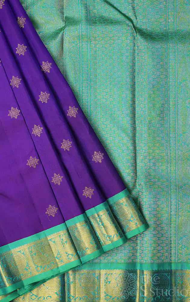 Violet Kanchipuram silk saree with sea green korvai border