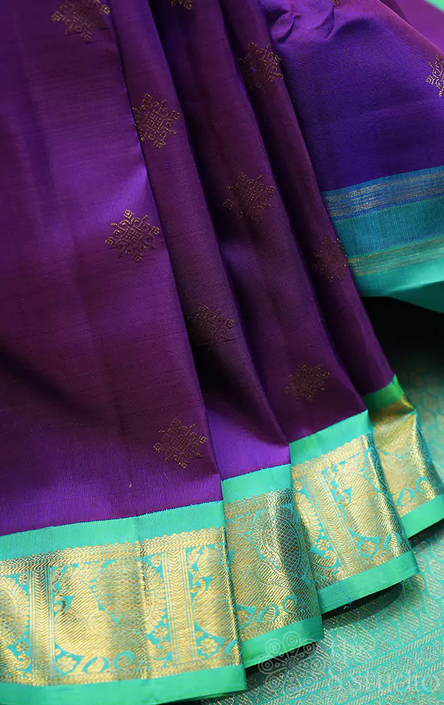 Violet Kanchipuram silk saree with sea green korvai border