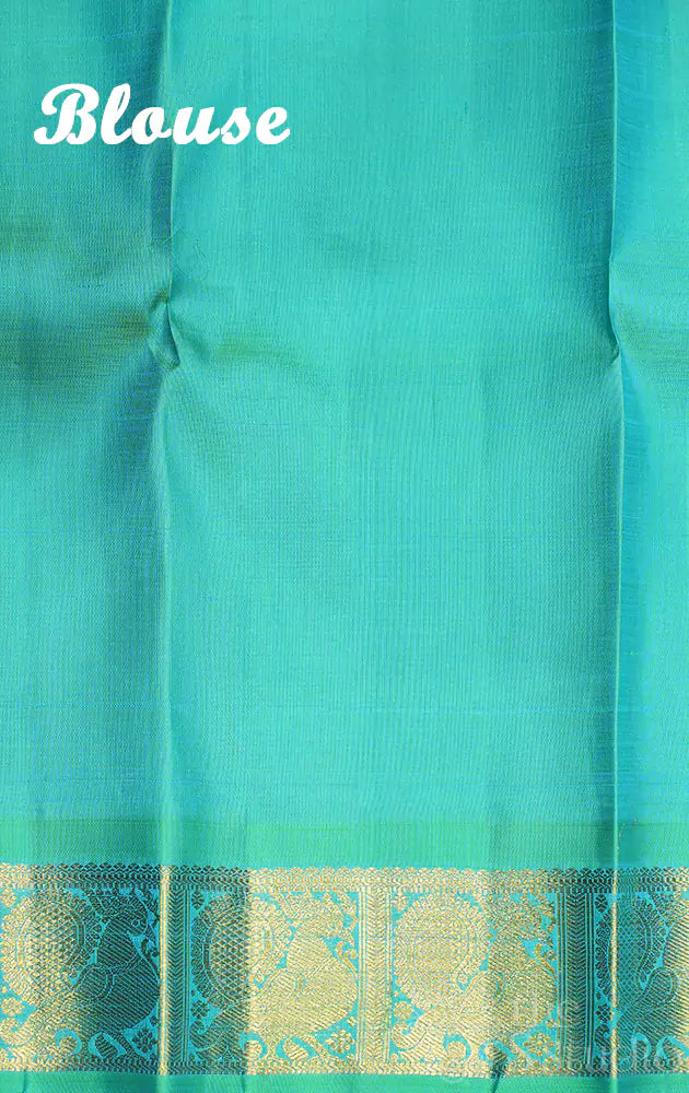 Violet Kanchipuram silk saree with sea green korvai border