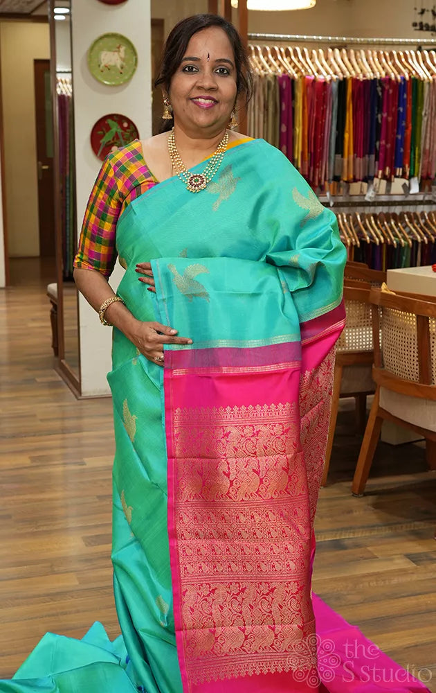 Bluish green colour kanchipuram silk saree with bird motifs