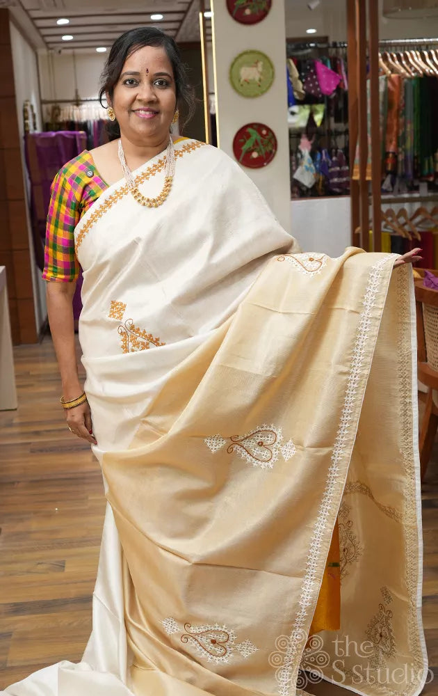 Off white and golden tissue kanchipuram silk saree with kutch embroidery