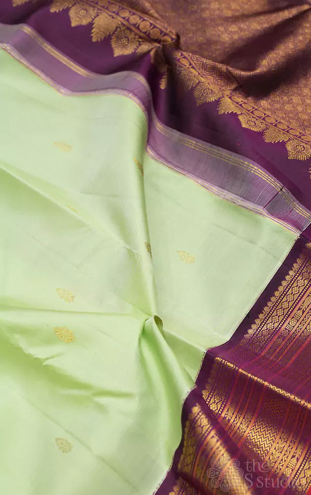 Pista green kanchi pattu saree with korvai purple border