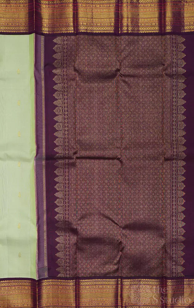 Pista green kanchi pattu saree with korvai purple border