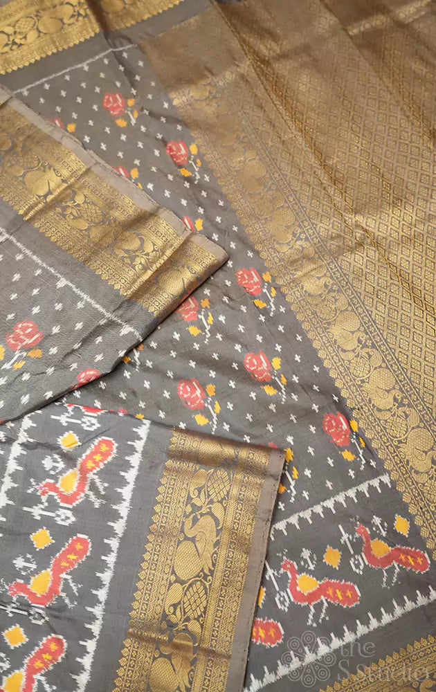 Grey ikkat silk saree with rich zari border