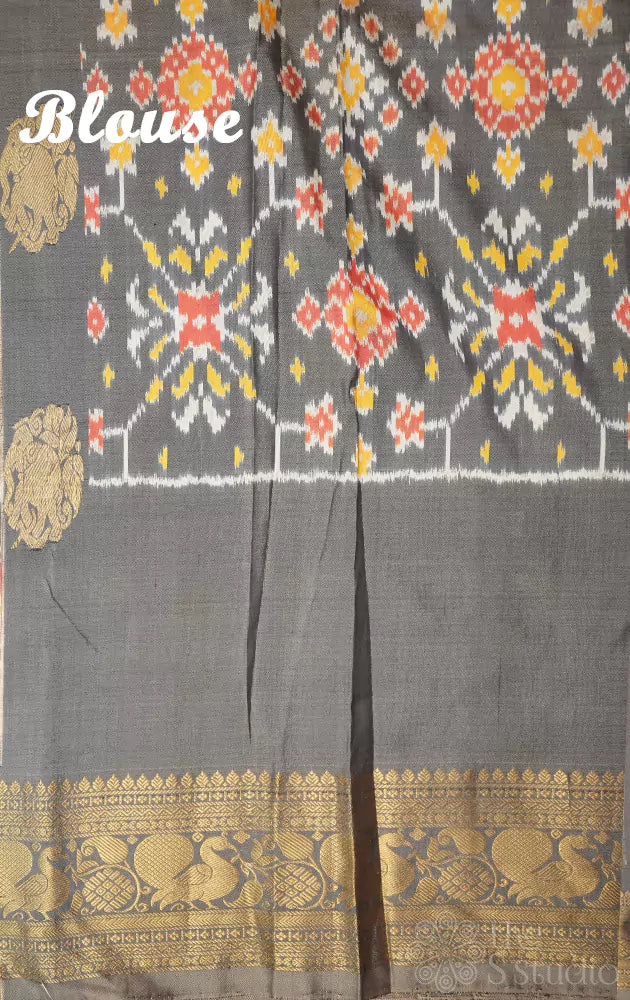 Grey ikkat silk saree with rich zari border