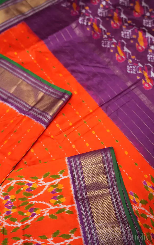 Orange ikkat silk saree with purple border