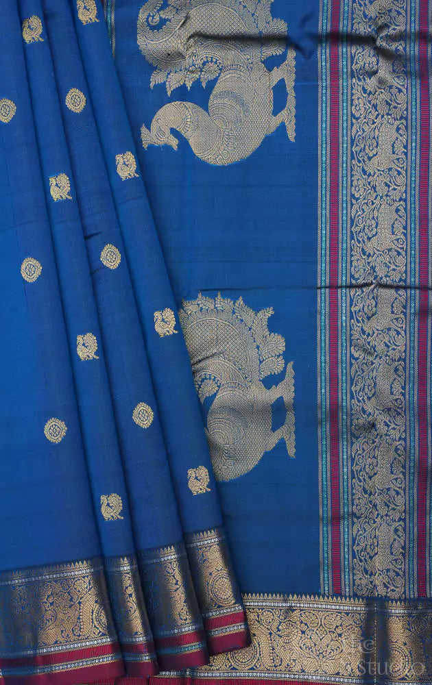 Peacock blue kanchi silk saree with mayil chakaram buttas