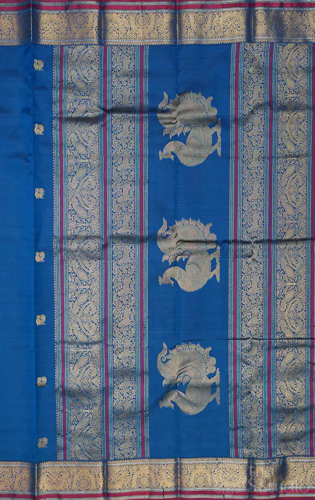 Peacock blue kanchi silk saree with mayil chakaram buttas
