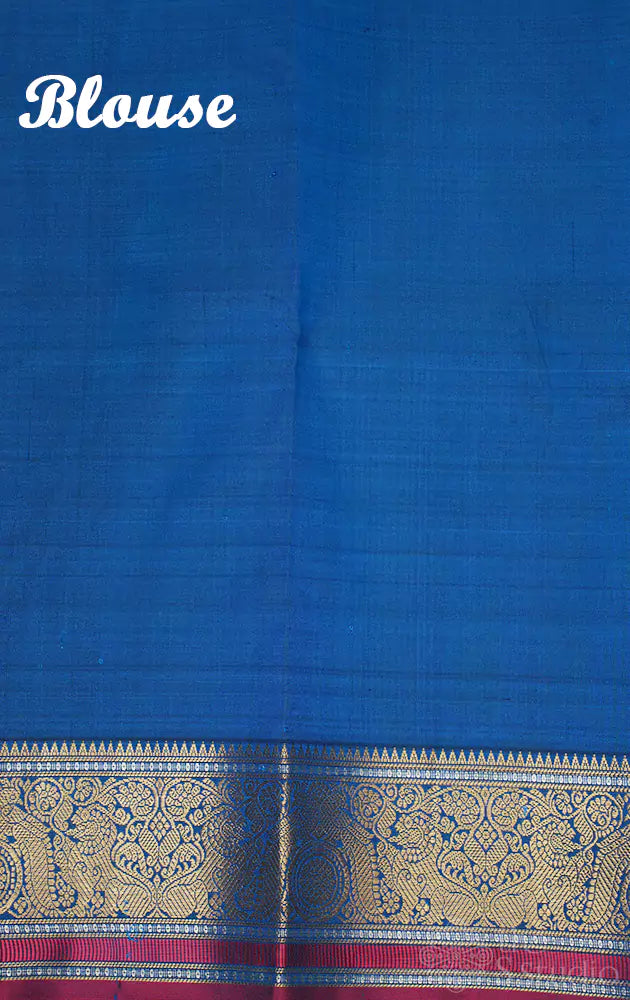 Peacock blue kanchi silk saree with mayil chakaram buttas