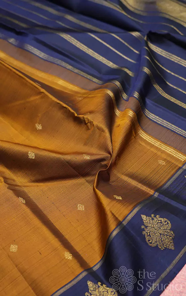 Golden brown kanjivaram silk saree with peacock buttas border