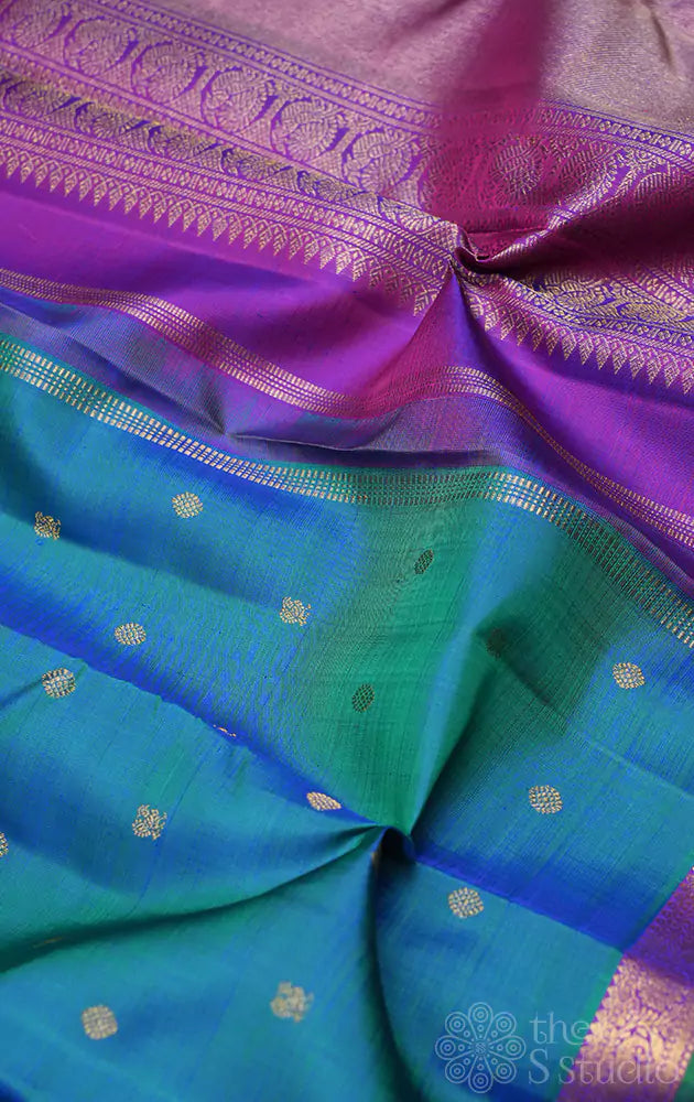 Peacock blue kanchi pattu saree with purple pallu