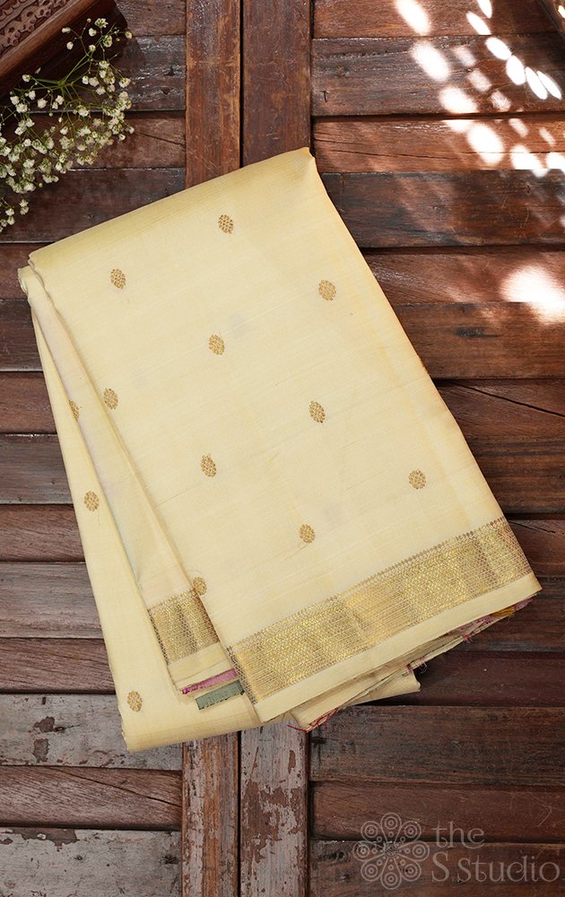 Off white kanchi silk saree with paalum pazhamum checks pallu and blouse