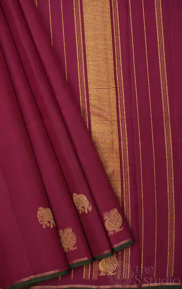 Maroon kanchipuram silk saree with border buttas