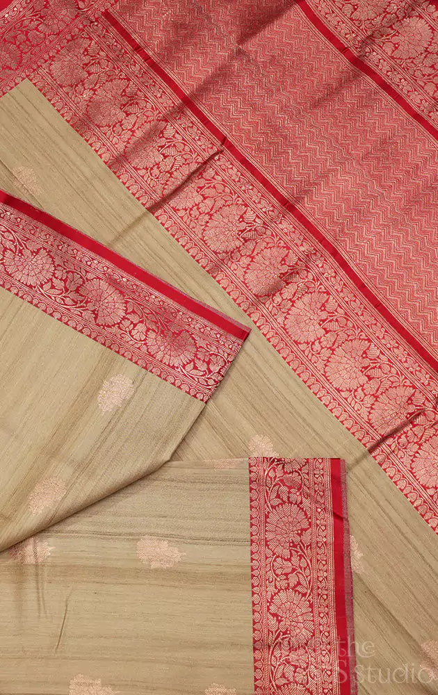 Beige handwoven tussar banarasi silk saree with red zari border