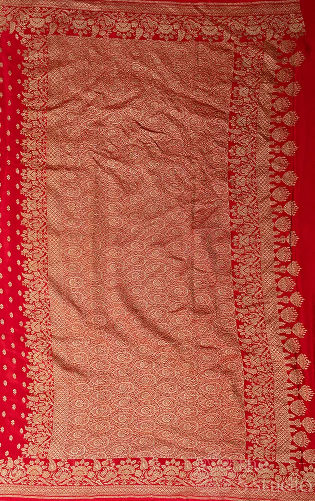 Red crepe banarasi silk saree with small antique zari buttas