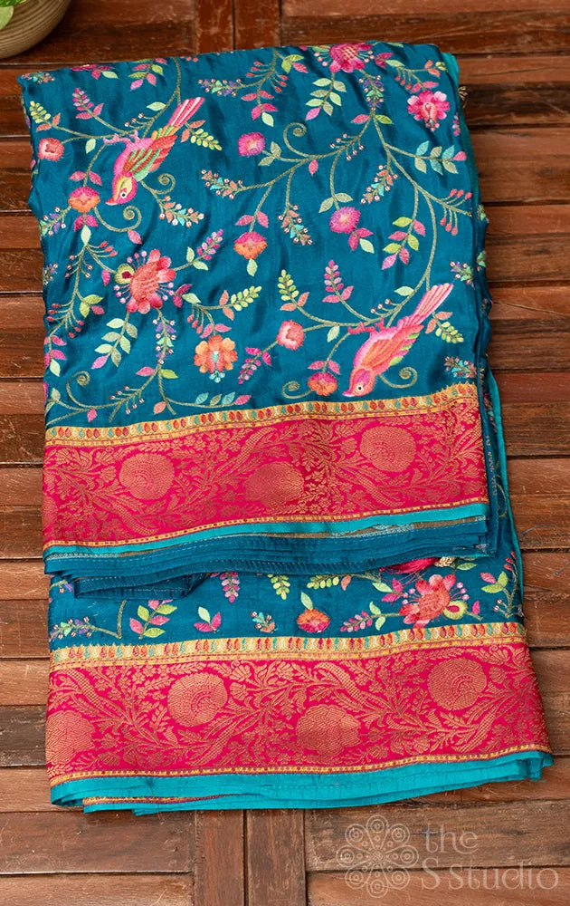 Blue semi crepe banarasi silk saree with floral and bird embroidery