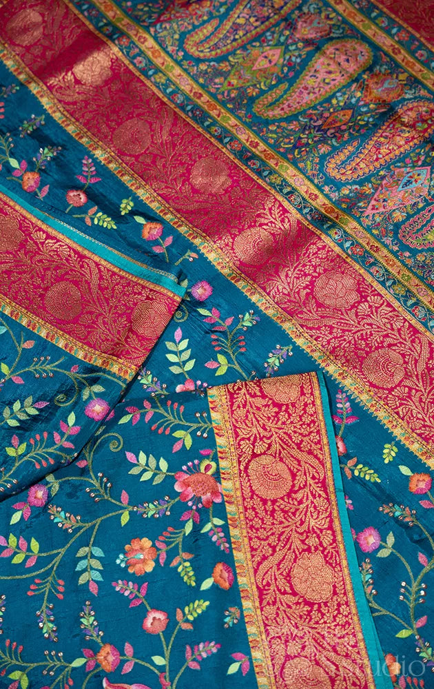 Blue semi crepe banarasi silk saree with floral and bird embroidery