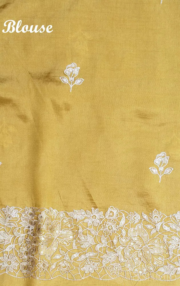 Light yellow semi banarasi silk saree with bird embroidery