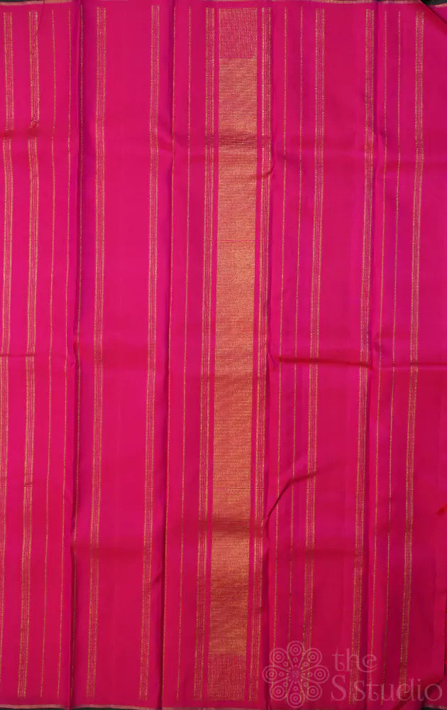 Rani pink kanjivaram saree with peacock border buttas