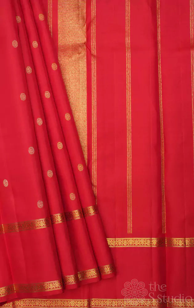 Red kanchi silk saree with small buttas and rettai pet border